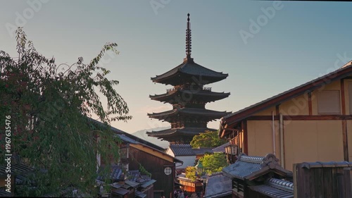 Kyoto, Japan - Oct 11 2024, 4k, Panoramic view of Yasaka Pagoda of Hōkan-ji Temple, building facades and trees in the foreground, in the evening, Kyoto, Japan
