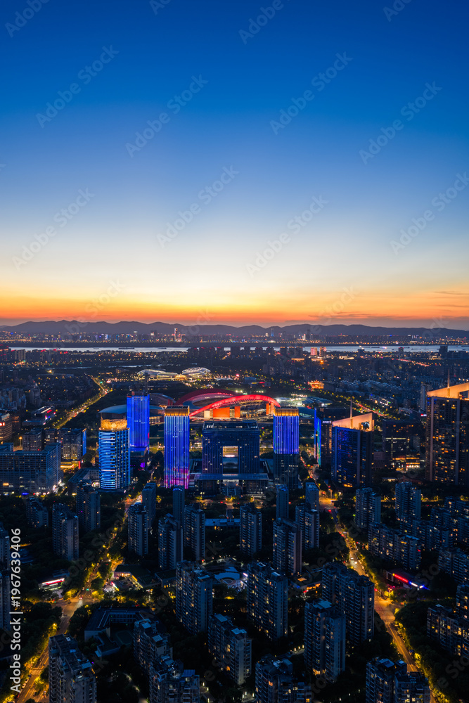 Fototapeta premium Aerial view of modern city at sunset
