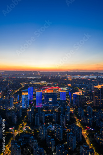Aerial view of modern city at sunset