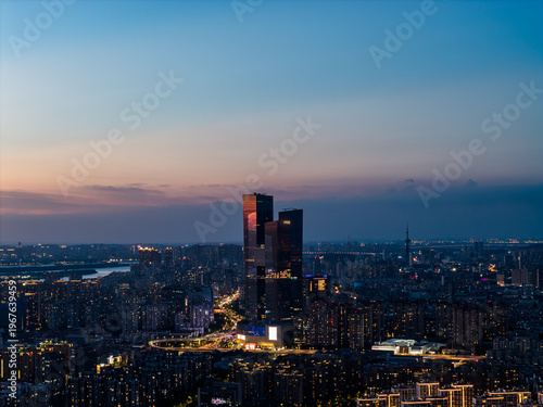 Aerial view of modern city at sunset