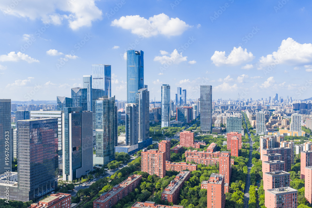 Fototapeta premium Aerial view of modern city with blue sky