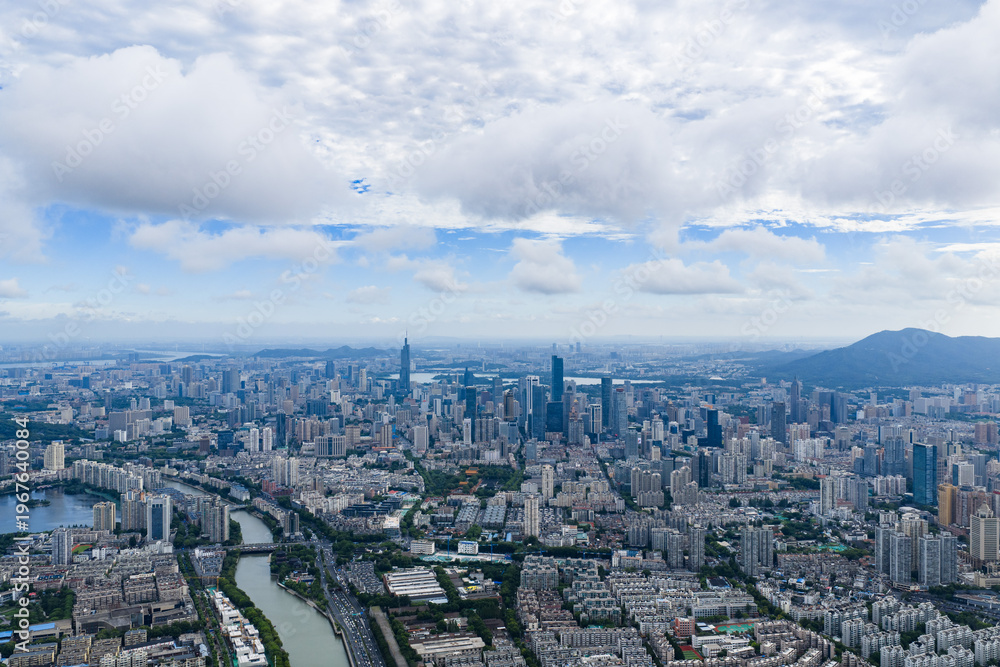 Fototapeta premium Aerial view of modern city with blue sky