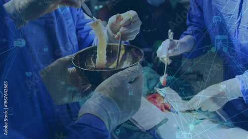 Animation of digital interface over surgeons in operating theatre