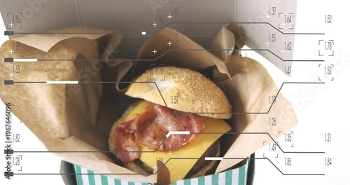 Camera starting blurred closeup zooming out revealing sesame bun cheese bacon with HUD for ad