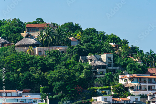 Elevated refuge: residential community integrated into the hillside tropical forest