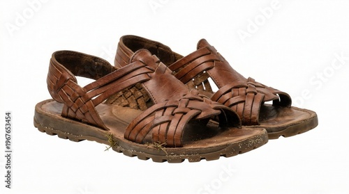 Wallpaper Mural Brown leather sandals with braided straps and rugged soles on white background Torontodigital.ca