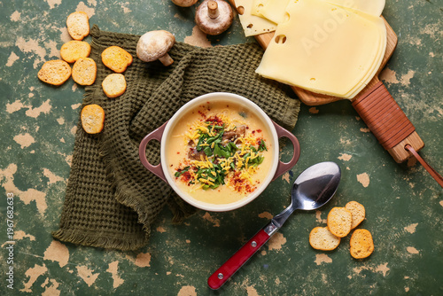 Bowl of tasty cheese soup w...