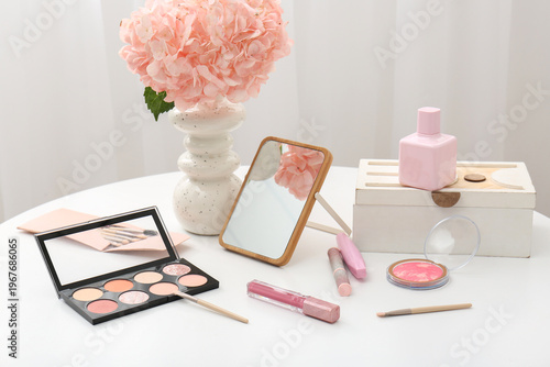 Vase with flowers, mirror, ...