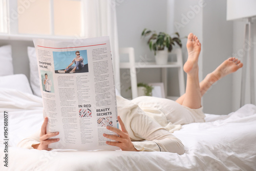 Young woman with newspaper ...