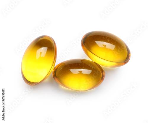 Vitamin E capsules on white...