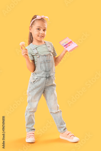 Cute little girl with makeu...