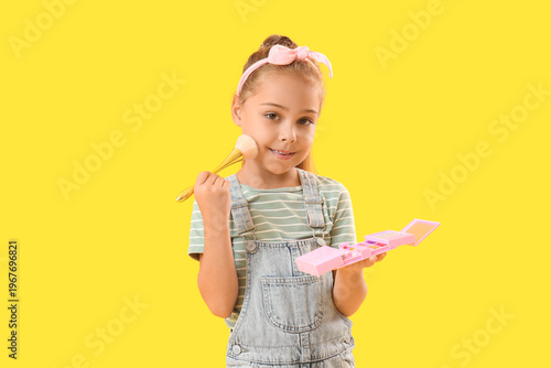 Cute little girl with makeu...