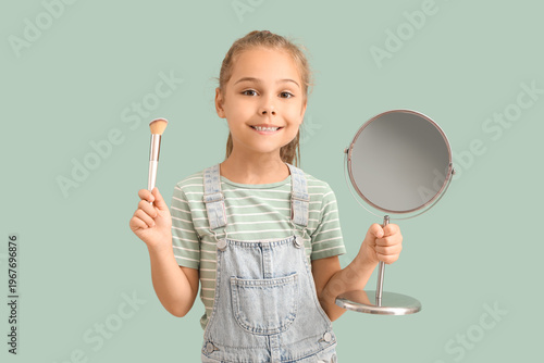 Cute little girl with mirro...