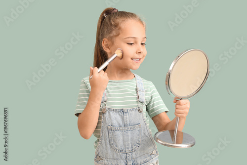 Cute little girl with mirro...
