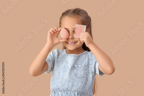 Cute little girl with makeu...