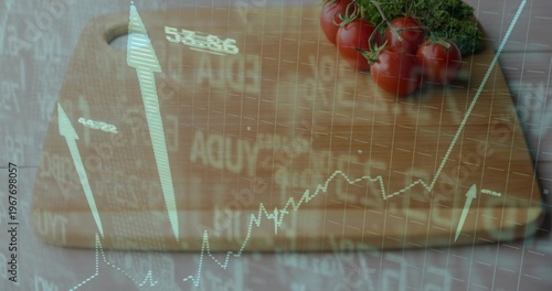 Displaying wood board handle holding tomatoes on vine and herb at kitchen counter with stock charts