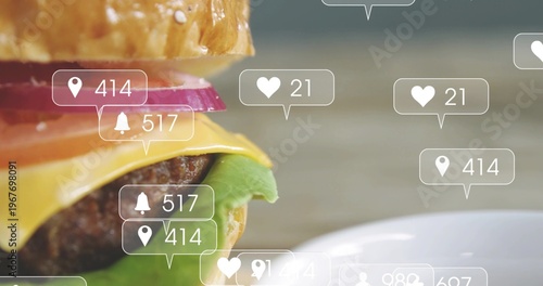 Framing burger with sesame bun, cheese, grilled patty, lettuce on wood table with social overlays