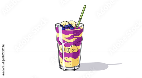Vibrant fruit smoothie with banana and blueberries in a glass, ready to drink.