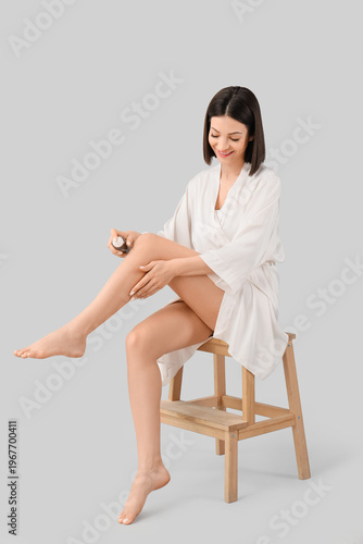 Happy young woman in bathro...