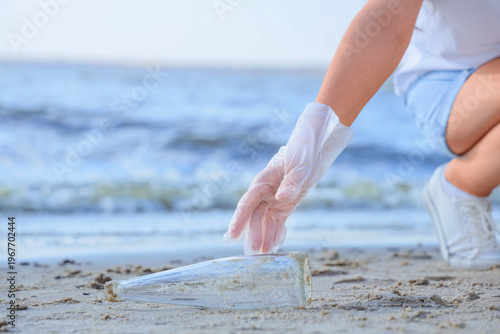 Young woman cleaning up gla...