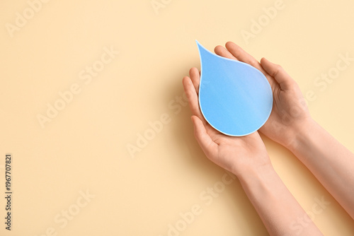 Female hands with paper wat...