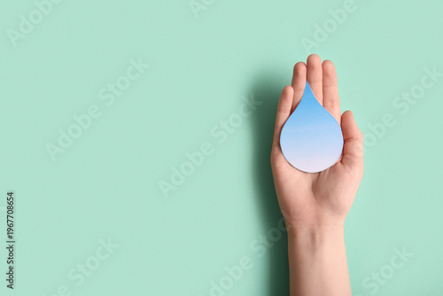 Female hand with paper wate...