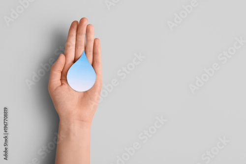 Female hand with paper wate...
