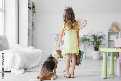 Cute little girl with Beagl...