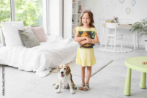 Cute little girl with Beagl...