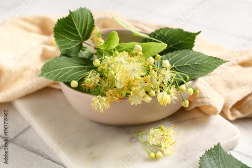 Bowl with fresh linden flow...