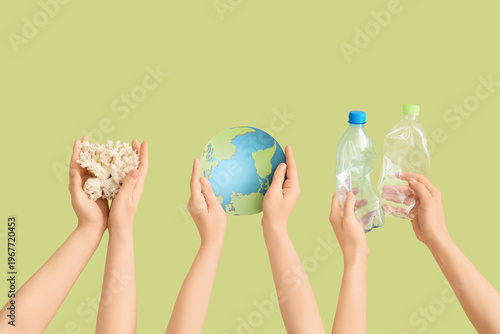 Hands holding model of Eart...