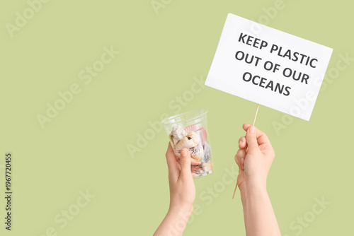 Hands holding paper sheet w...