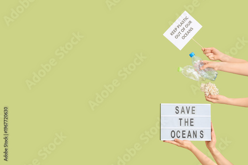 Hands holding paper sheet w...