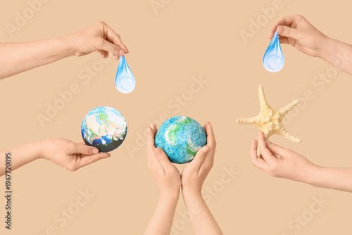 Hands holding model of Eart...