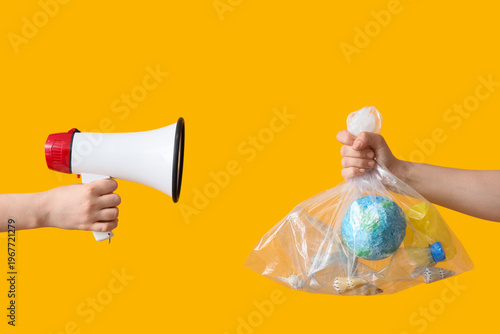 Hands holding megaphone and...