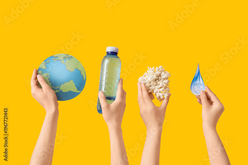 Hands holding coral, water ...