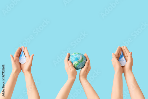 Hands holding model of Eart...