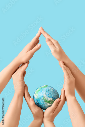 Hands with model of Earth f...
