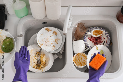 Woman in rubber gloves with...