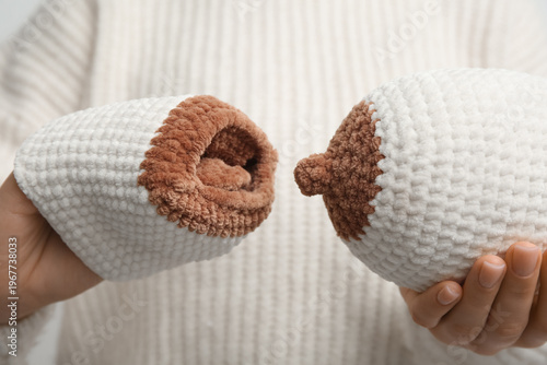 Woman with knitted model of...
