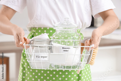 Housewife holding basket wi...