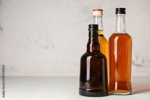 Bottles of rum on white bac...