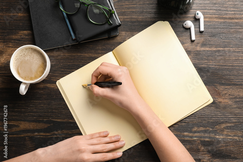 Woman writing something in ...