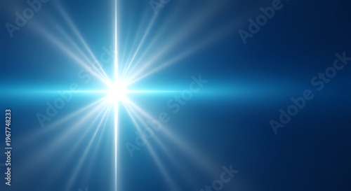 A bright light shines in a dark blue background with radiant beams