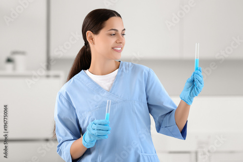 Happy female young scientis...