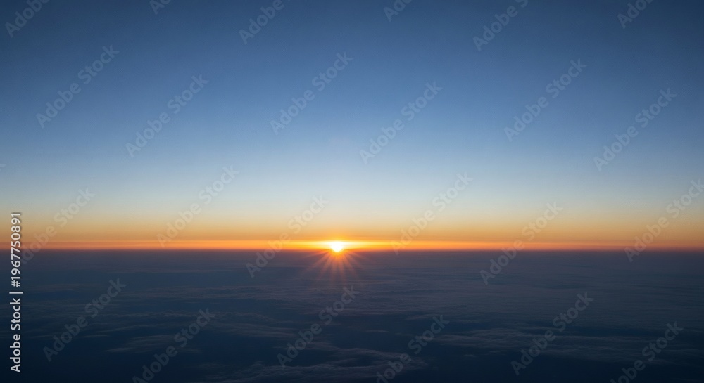 Fototapeta premium Sunrise over calm ocean horizon with golden sky