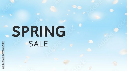 Spring Sale text on blue sky with falling flower petals