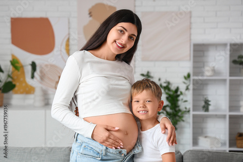 Young pregnant woman and he...