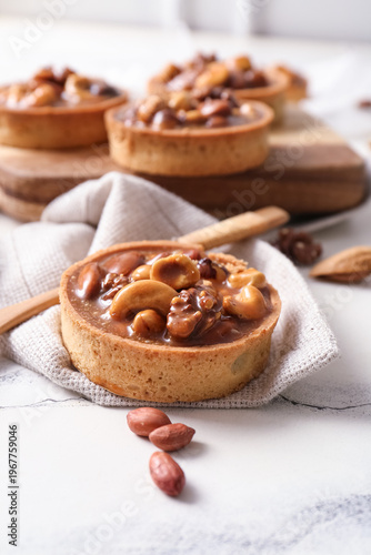 Tasty tarts with nuts and c...
