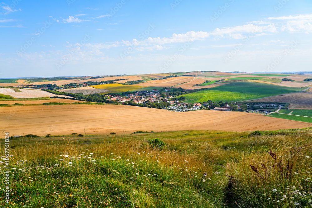 Fototapeta premium Panoramic view of the charming village of Escalles surrounded by golden wheat fields on the Opal Coast in Pas-de-Calais, Northern France